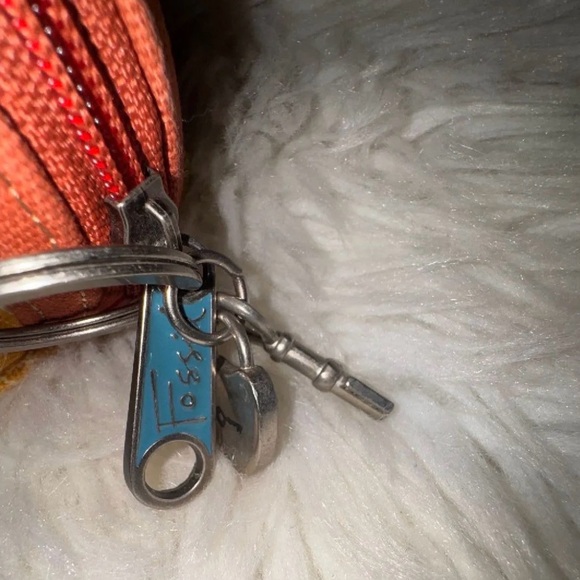 Fossil canvas cosmetic pouch featuring a floral pattern and a signature key fob - Picture 4 of 7